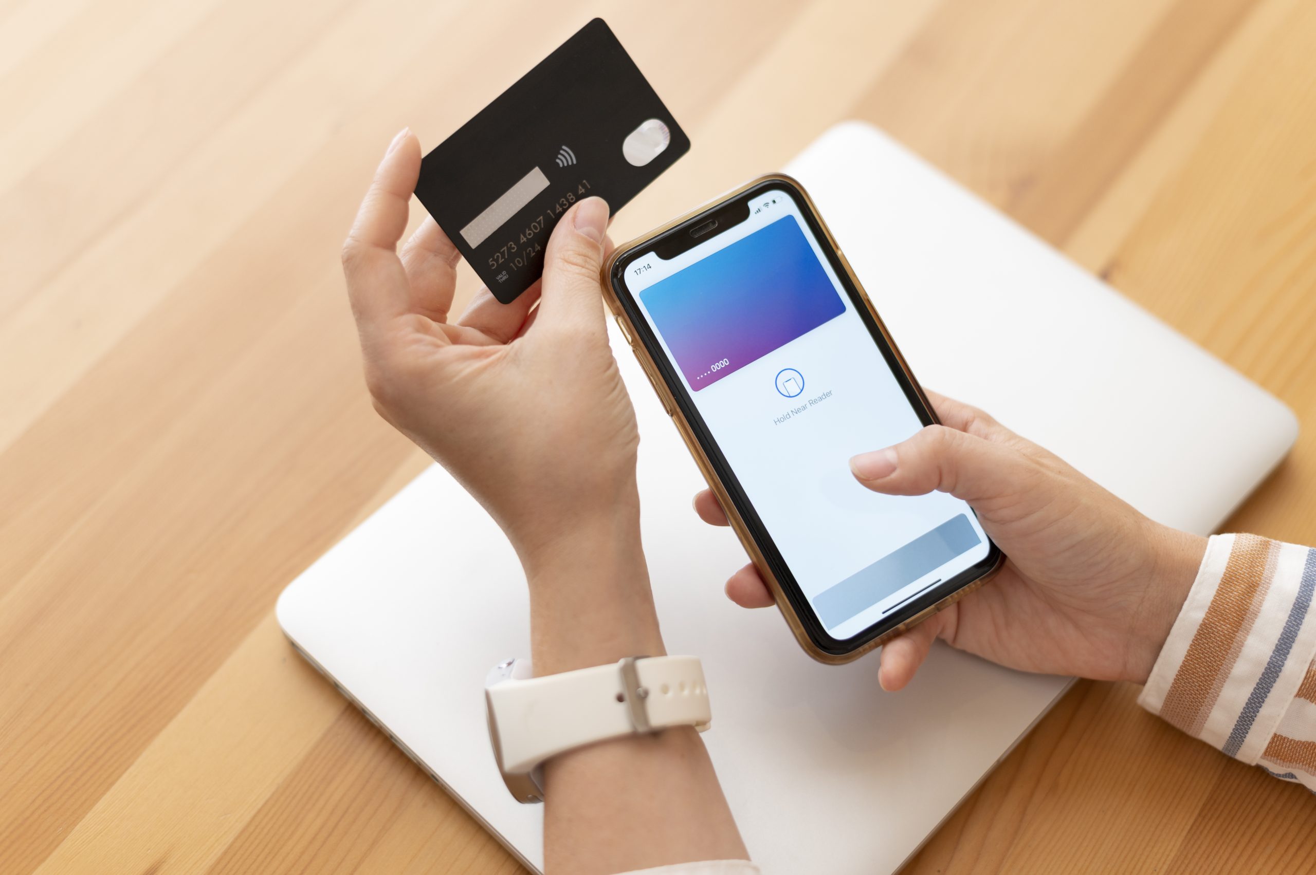 person-paying-with-its-smartphone-wallet-app-scaled Perkembangan Transaksi Digital dan Dampaknya terhadap Perekonomian Modern